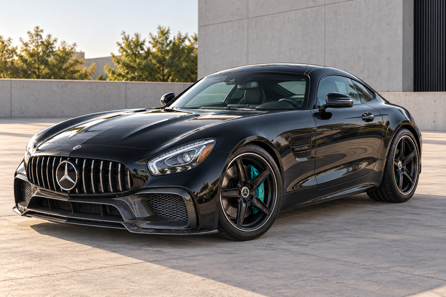 Black Mercedes-AMG GT with carbon fiber front and dark wheels