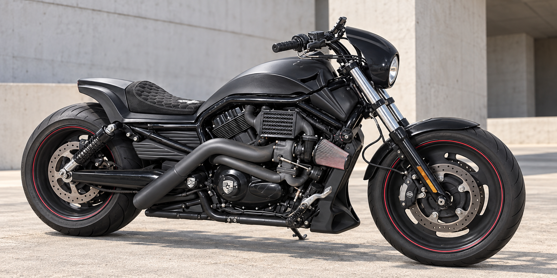 Black custom Harley-Davidson motorcycle with red wheel accents
